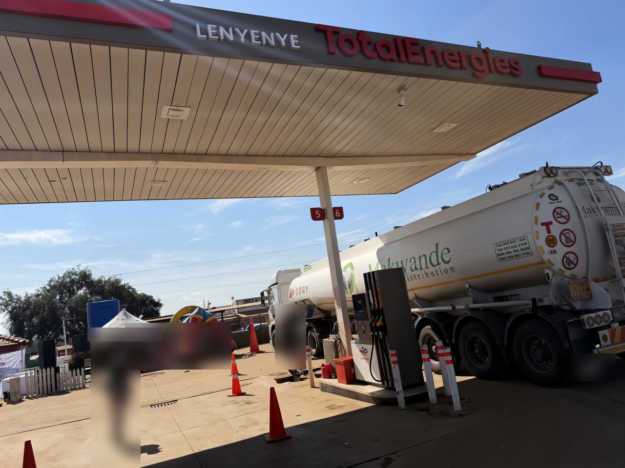 The Total Lenyenye forecourt under the LENYENYE TotalEnergies canopy, with a fuel tanker making a delivery